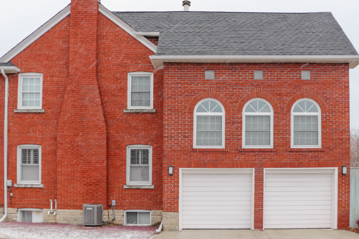 Unfinished brick home with rhino shield coating.