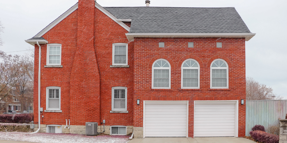 Unfinished brick home with rhino shield coating.